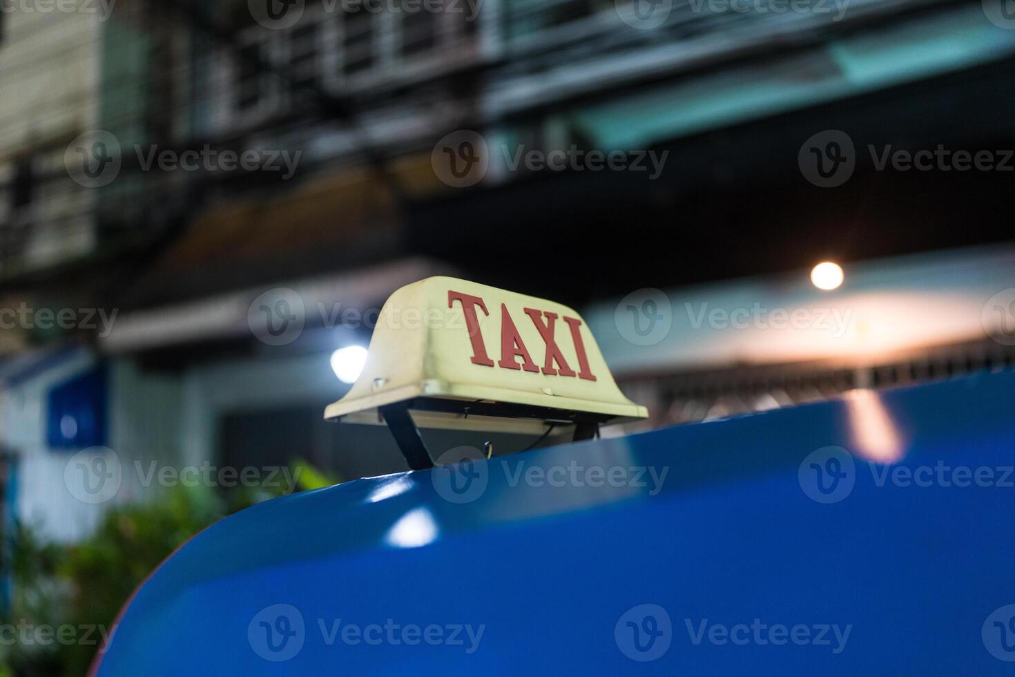 Thailand three wheel native taxi. Close up of text of TAXI on car roof, Thailand Tuk Tuk photo