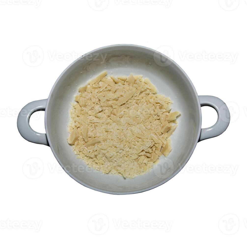 Cocoa butter background, top view, texture. Cocoa butter is one of the ingredients in making chocolate at home. Close-up of crushed cocoa butter, top view. photo