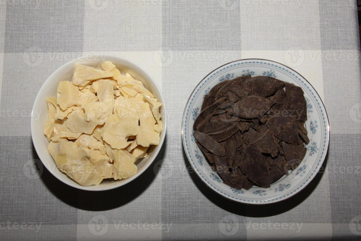 Containers with cocoa butter and grated cocoa, top view, texture. Basic ingredients for making chocolate at home. Close-up of chopped food, top view. photo