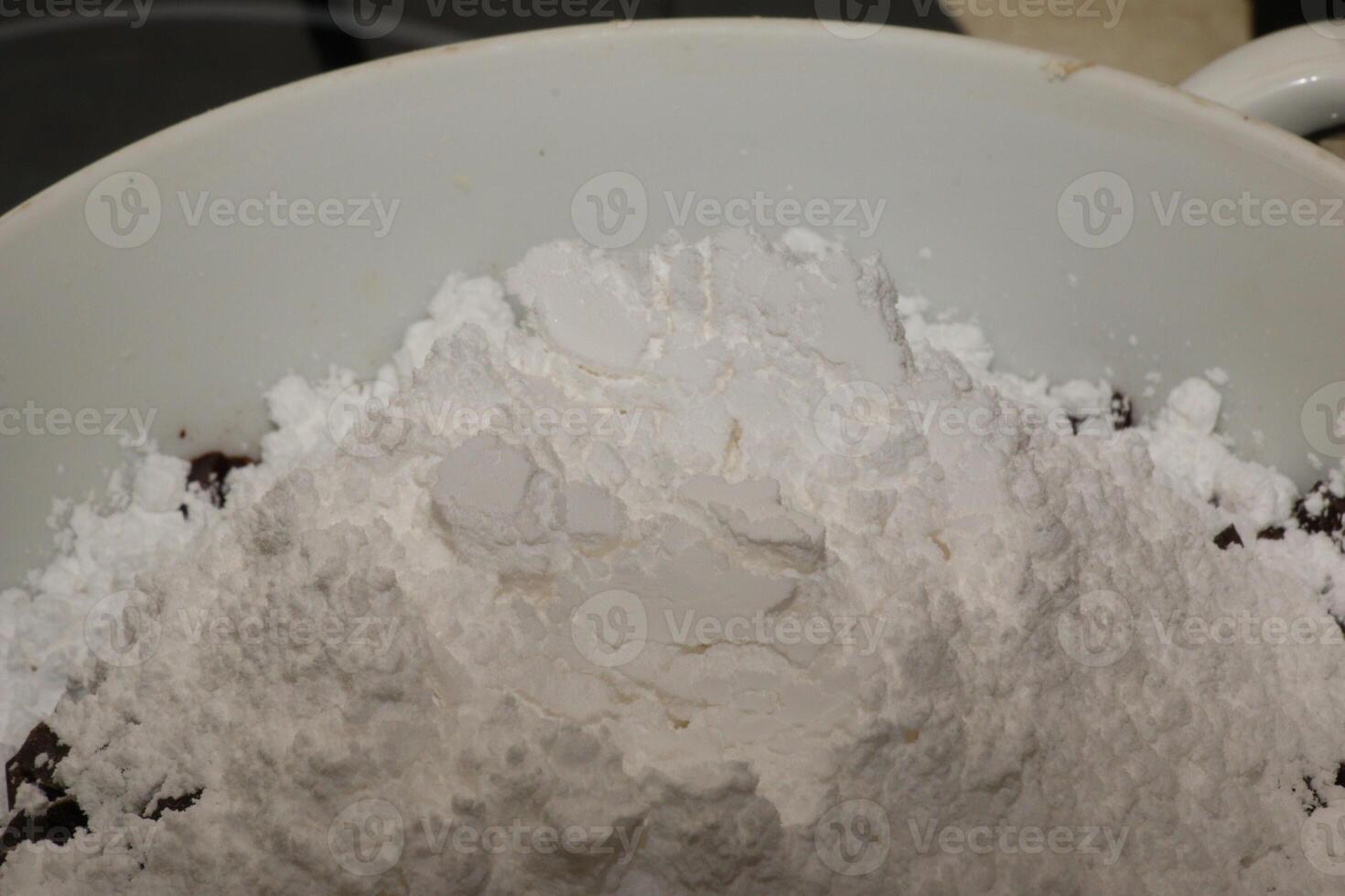 Powdered sugar in a container for making chocolate. photo