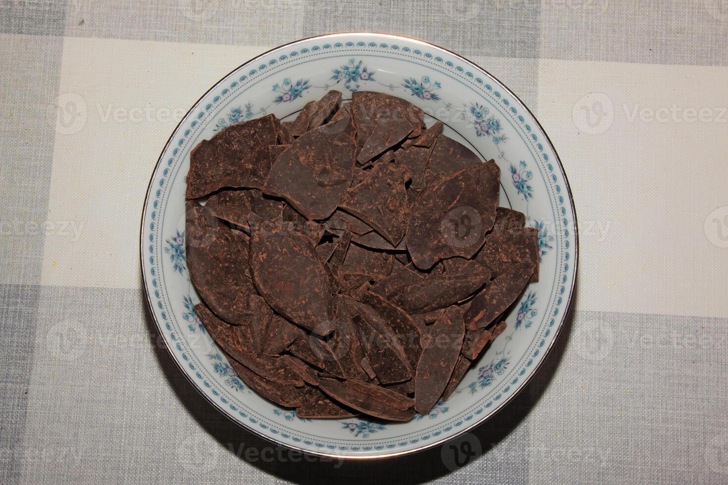 Grated cocoa background, top view, texture. Grated cocoa is one of the ingredients in making chocolate at home. Close-up of crushed cocoa, top view. photo