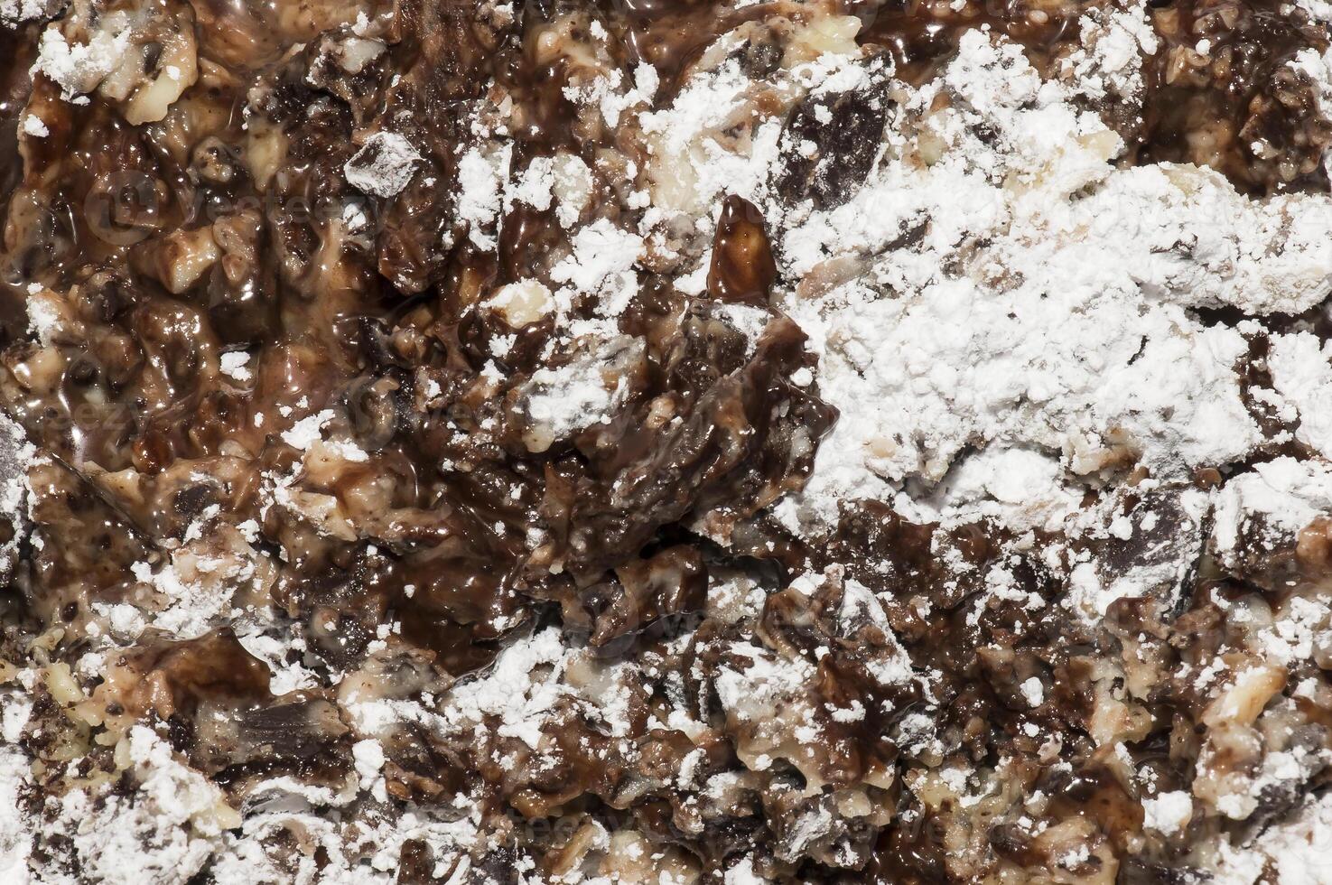 Cocoa butter and cocoa liquor melt, top view, texture. Basic ingredients for making chocolate at home. Close-up of chopped food, top view. photo