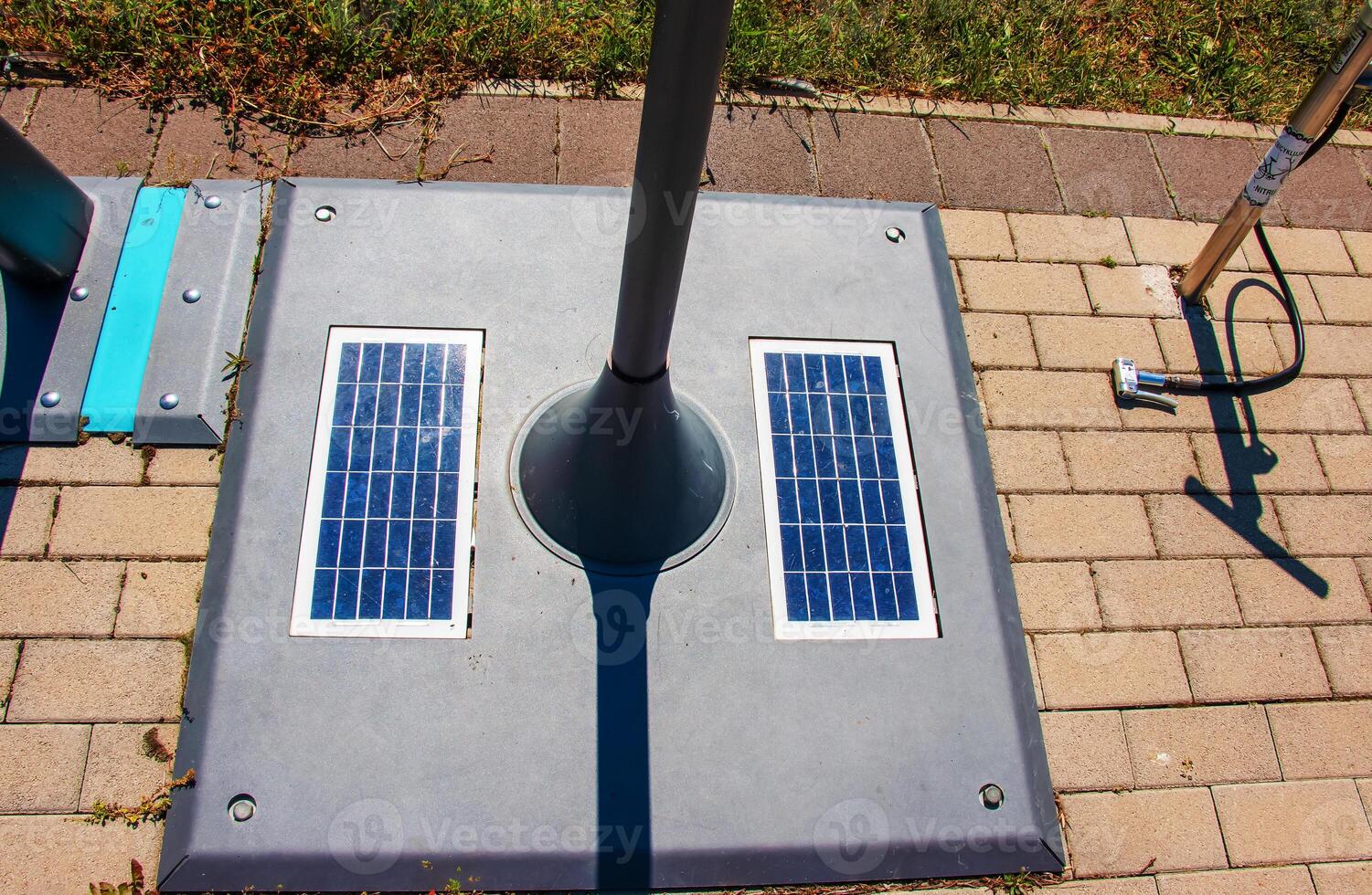 Solar panels in the bike park. Alternative energy source. Energy crisis. photo