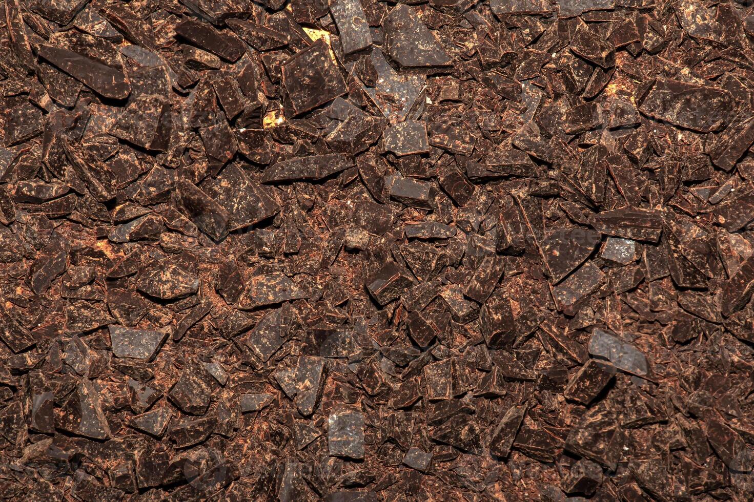 Grated cocoa background, top view, texture. Grated cocoa is one of the ingredients in making chocolate at home. Close-up of crushed cocoa, top view. photo