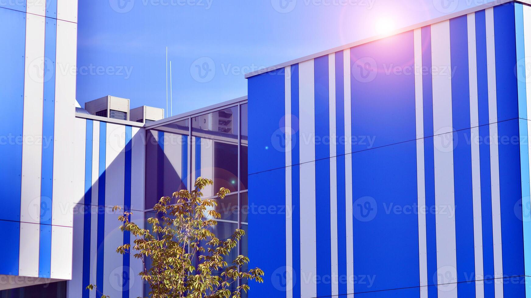 Abstract modern business architecture. Office building with aluminum composite panels. Facade wall made of glass and metal. photo