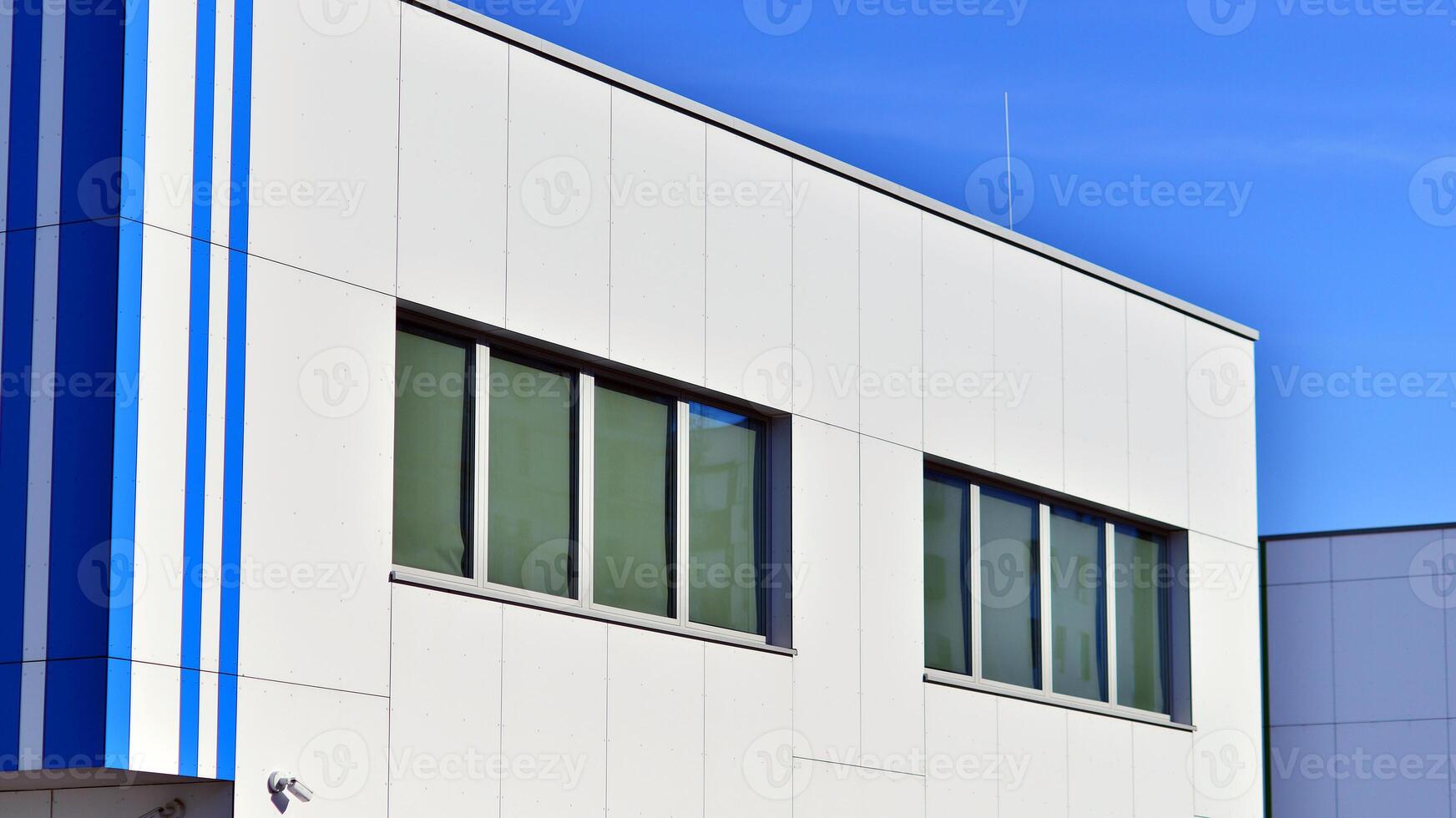 Abstract modern business architecture. Office building with aluminum composite panels. Facade wall made of glass and metal. photo