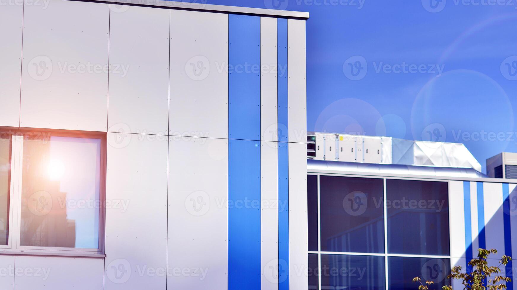 Abstract modern business architecture. Office building with aluminum composite panels. Facade wall made of glass and metal. photo