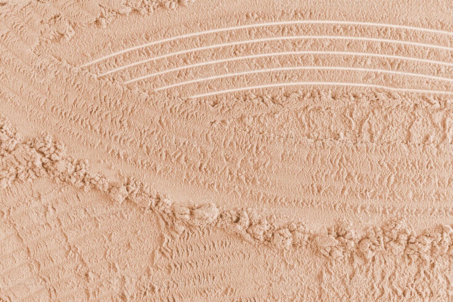 Chic cosmetic background texture of loose dry powder in a delicate light tone. Abstract beautiful lines of powder texture. layout, design photo