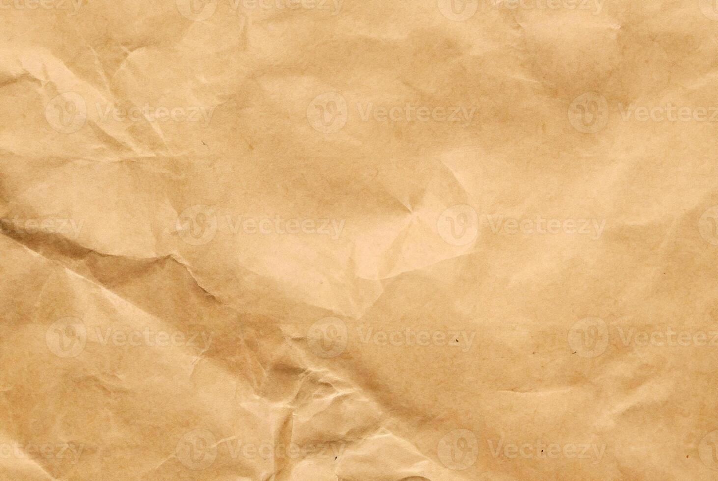 High-resolution brown paper texture with natural creases and subtle wrinkles. photo