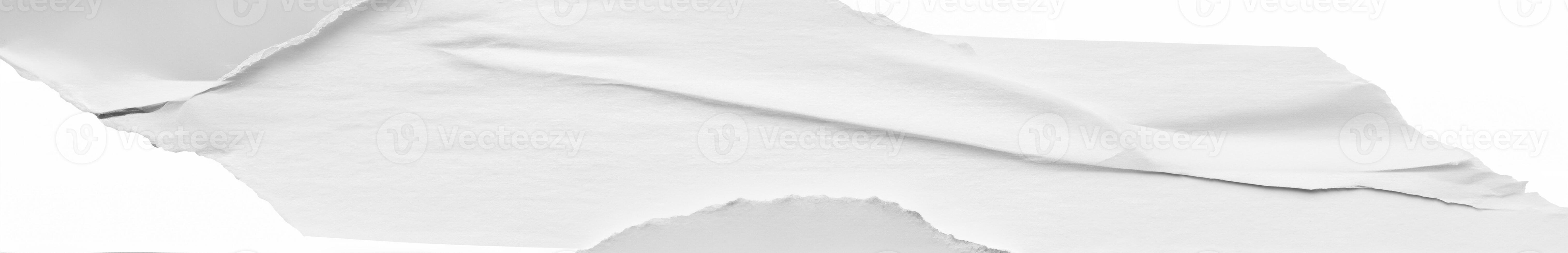 Isolated torn edge of white paper with curled texture, perfect for design overlays and creative backgrounds. photo