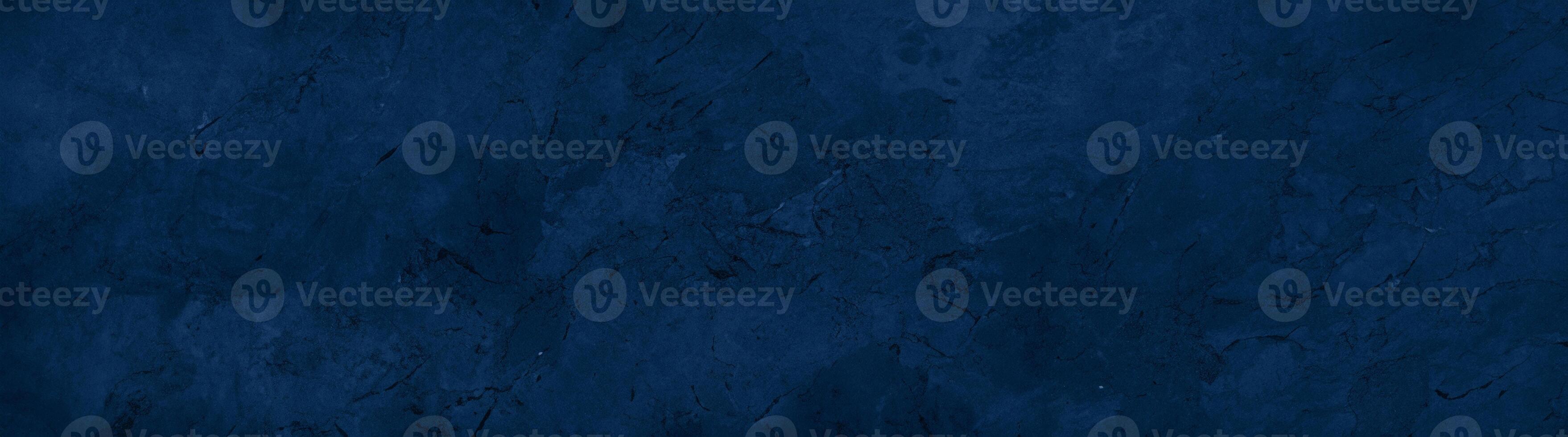 Close-up of a dark blue textured stone surface with subtle patterns and natural marbling, ideal for backgrounds. photo