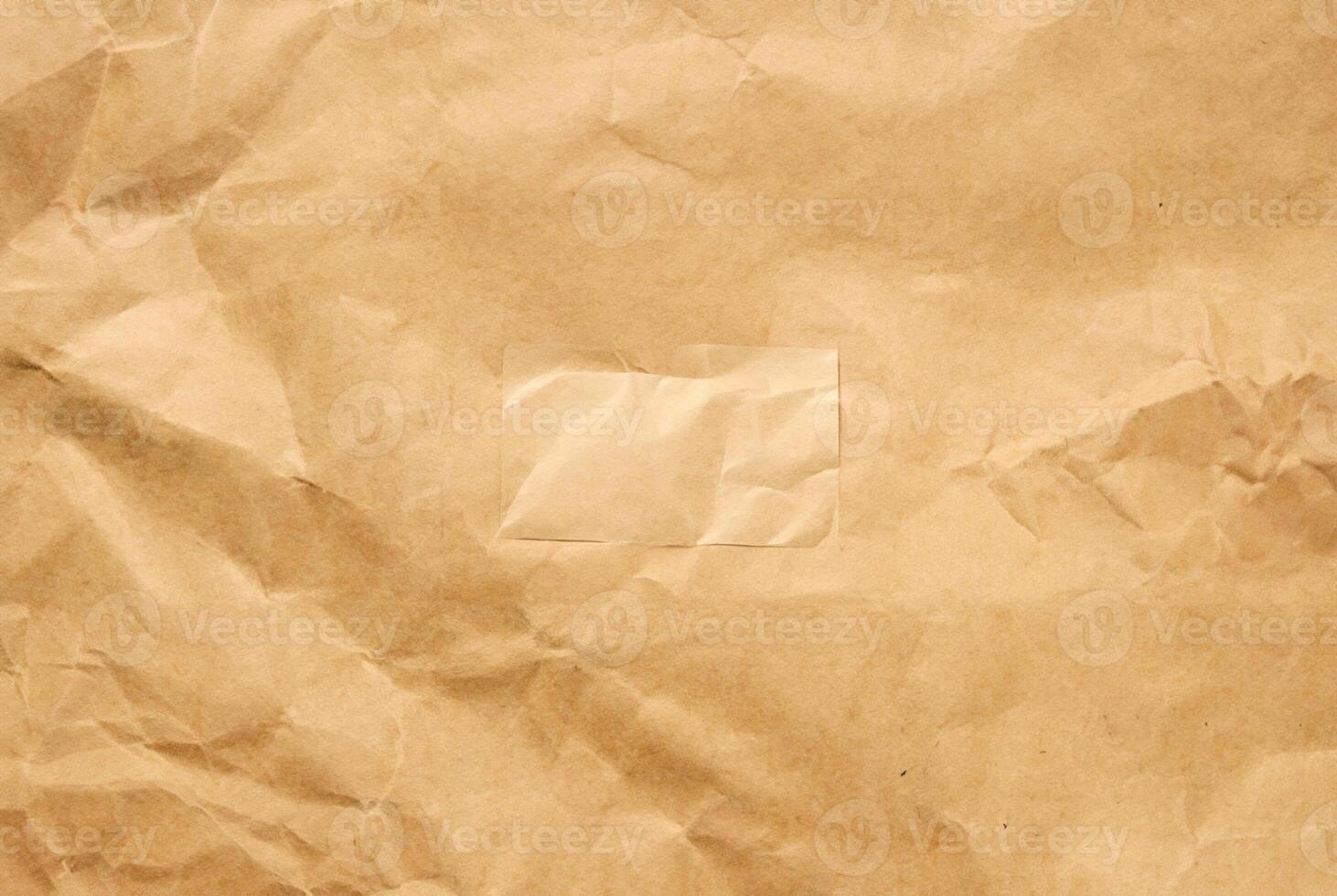 High-resolution brown paper texture with natural creases and subtle wrinkles. photo