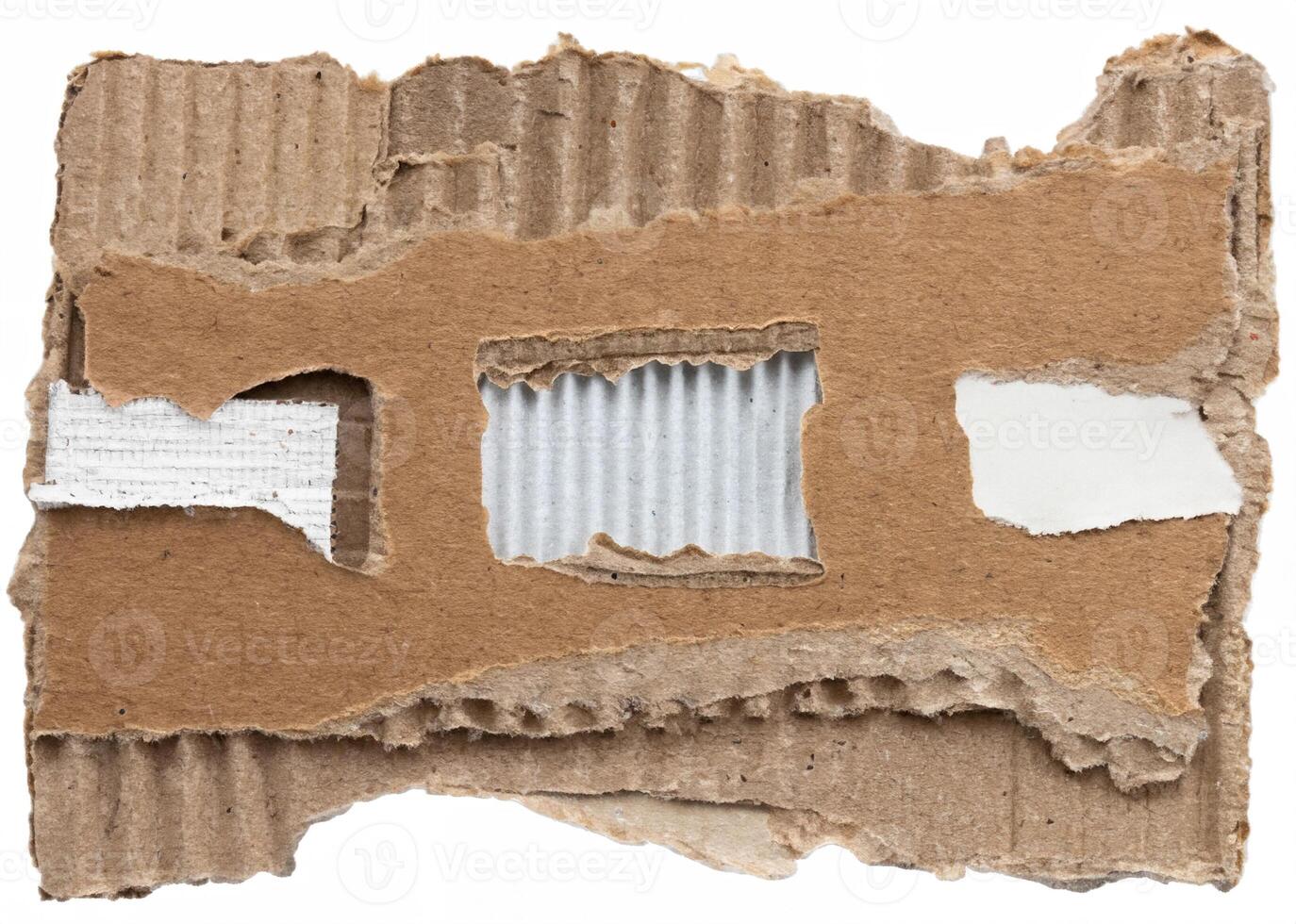 Close-up of torn corrugated cardboard with rough edges and visible texture, ideal for backgrounds and craft designs. photo