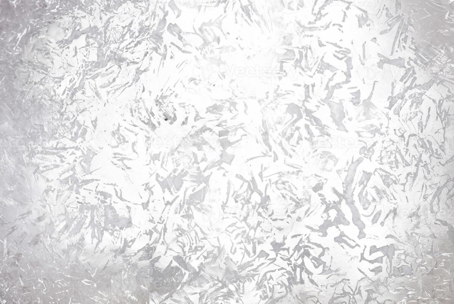 Abstract silver metallic textured background with brushed, irregular patterns, ideal for use in design projects, backgrounds, or as an overlay. photo