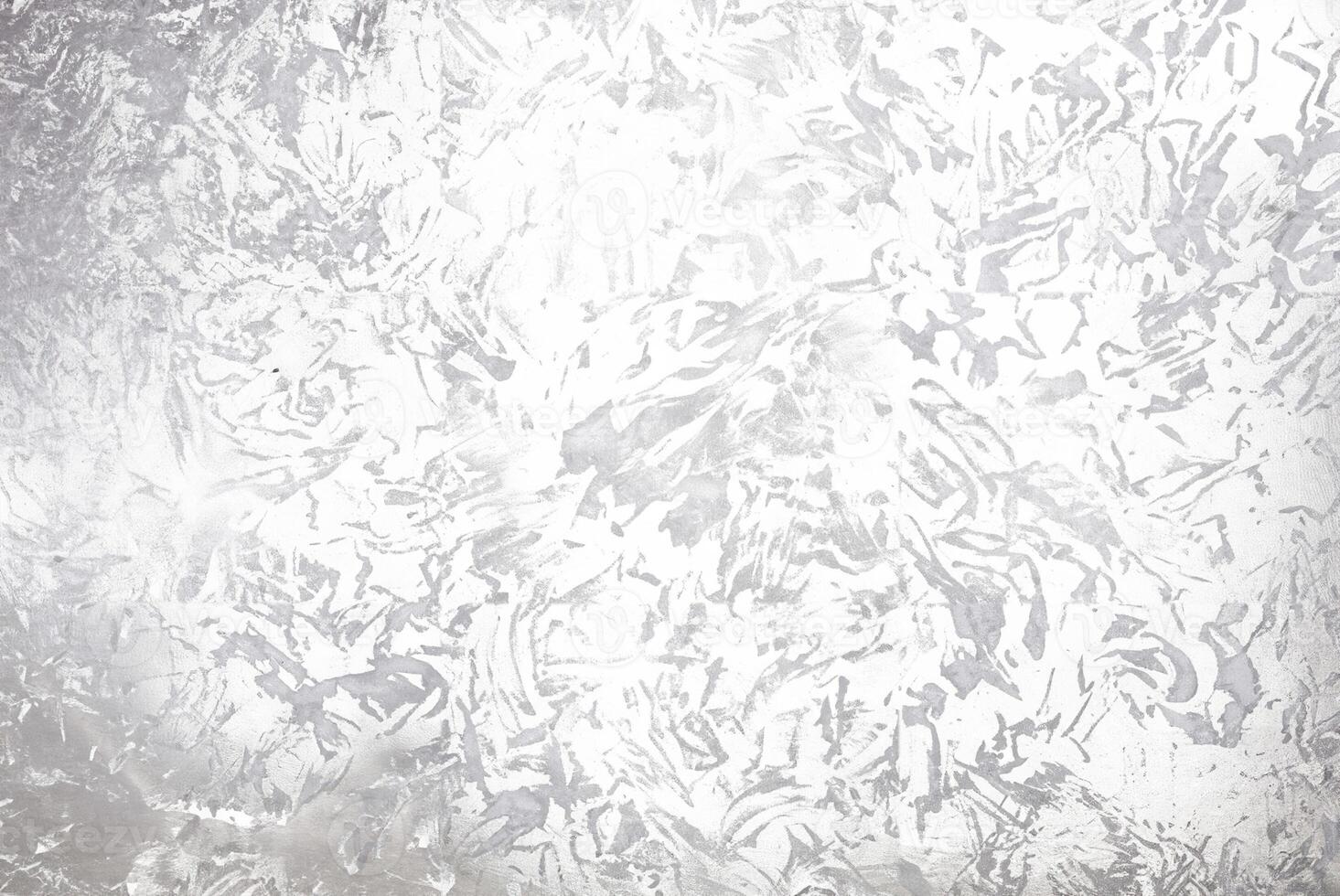 Abstract silver metallic textured background with brushed, irregular patterns, ideal for use in design projects, backgrounds, or as an overlay. photo