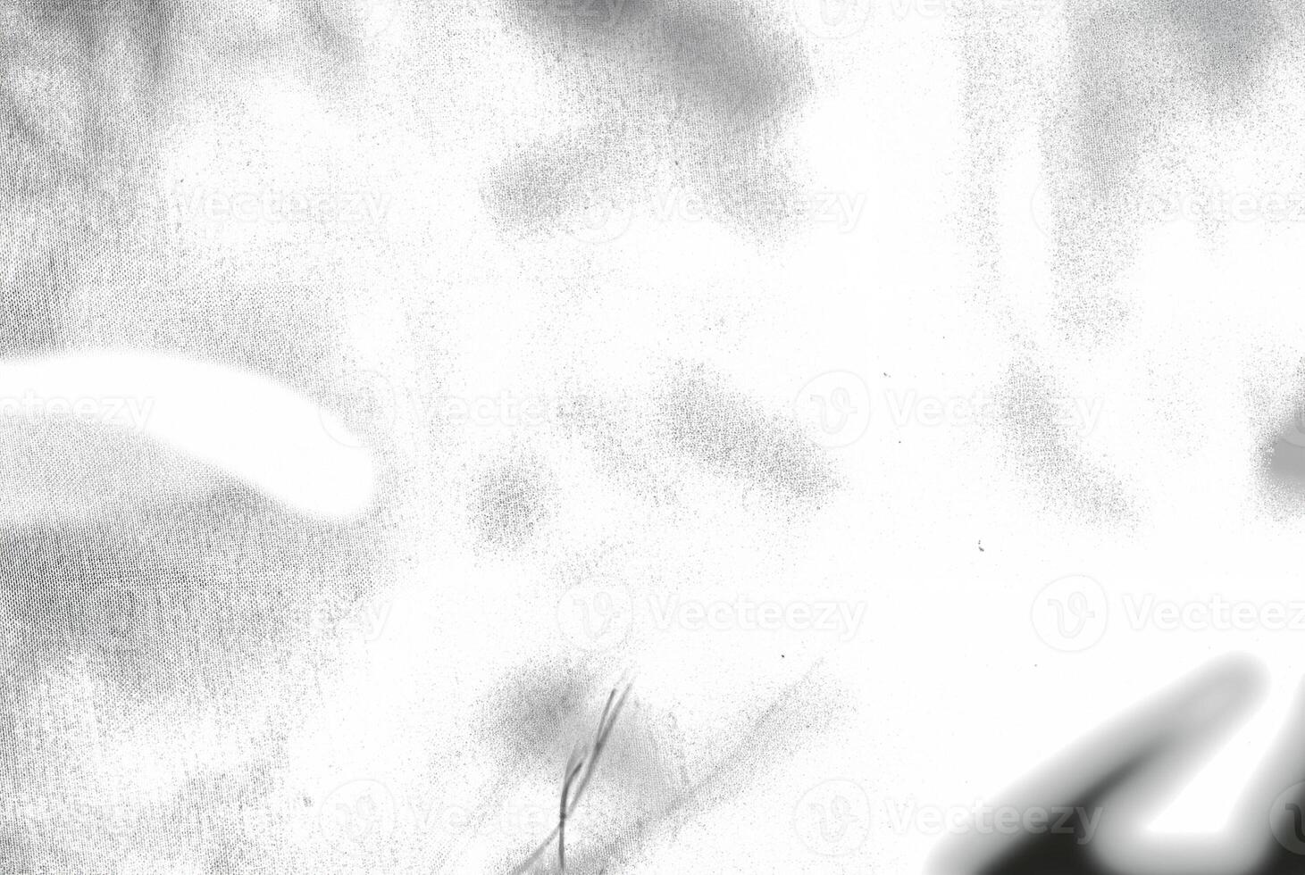 An abstract texture with an overexposed appearance, showing faint shadows in soft, indistinct forms. photo