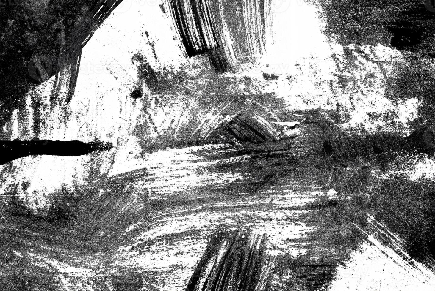 Abstract black and white grunge texture with rough brush strokes and splatters, ideal for backgrounds or artistic designs. photo