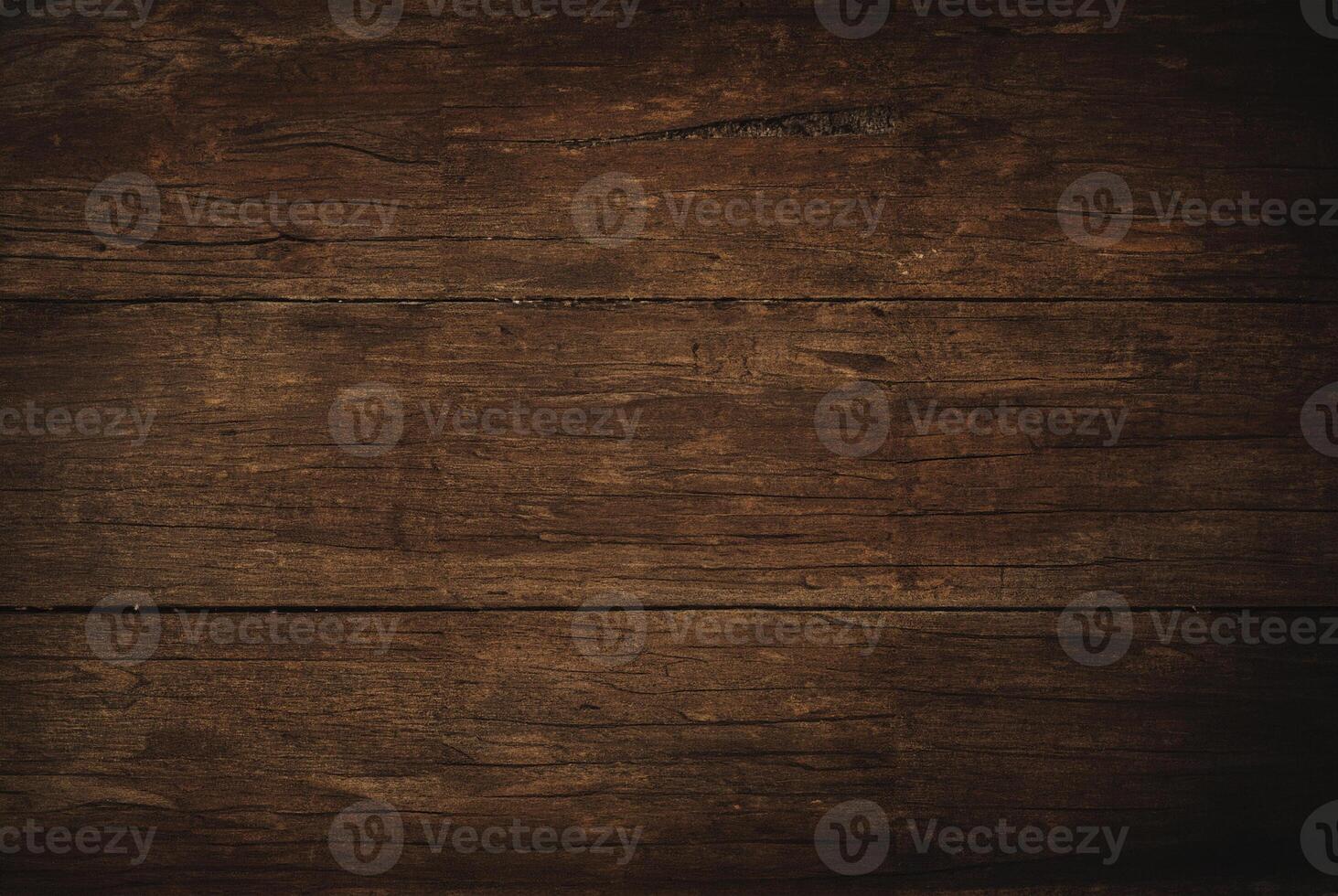 Close-up of a dark rustic wooden plank surface with natural textures and wood grain patterns. photo