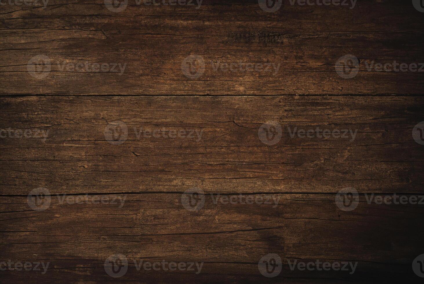 Close-up of a dark rustic wooden plank surface with natural textures and wood grain patterns. photo