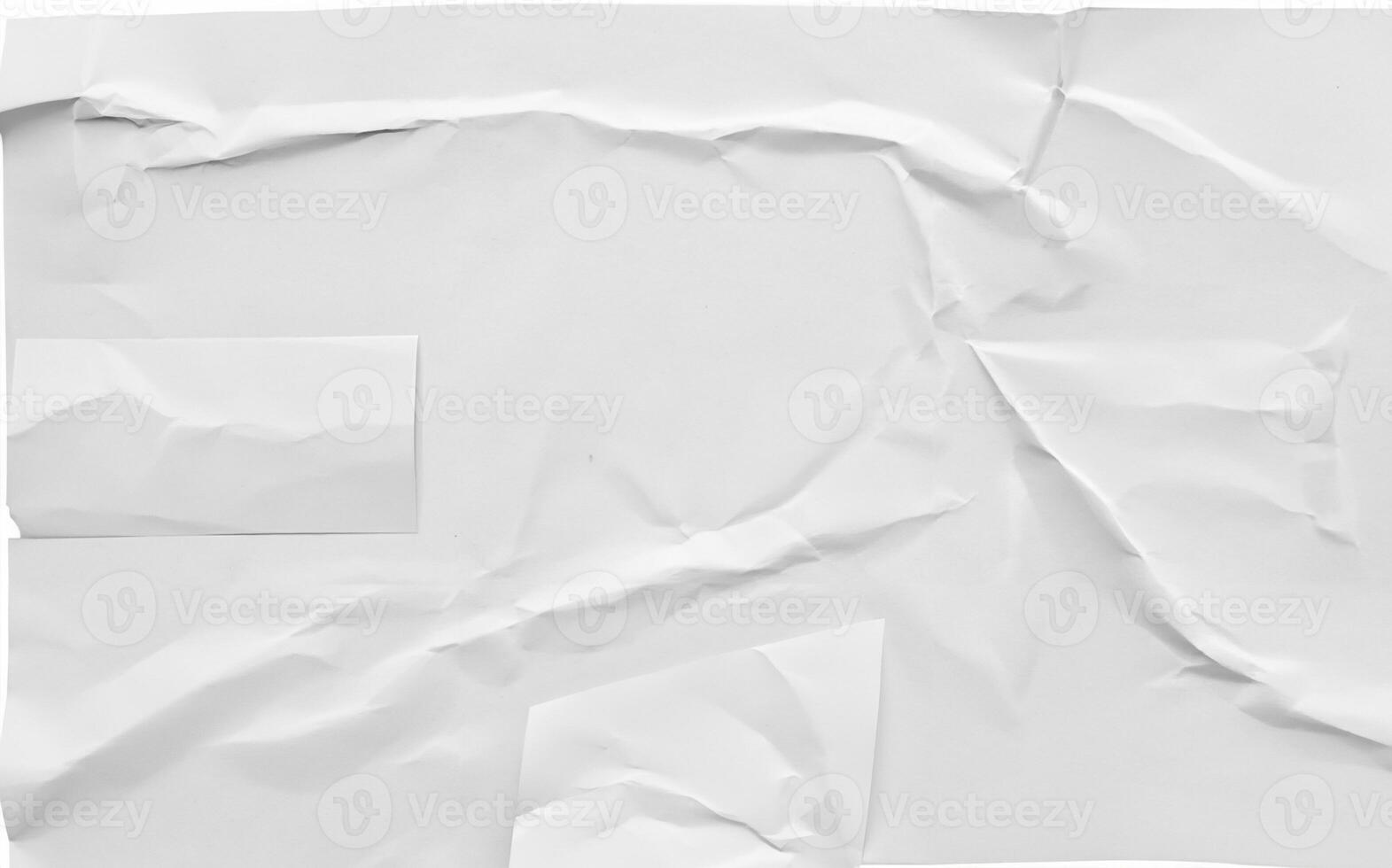 Crumpled white sheet of paper with folds and creases, isolated on a white background, ideal for design or texture use. photo