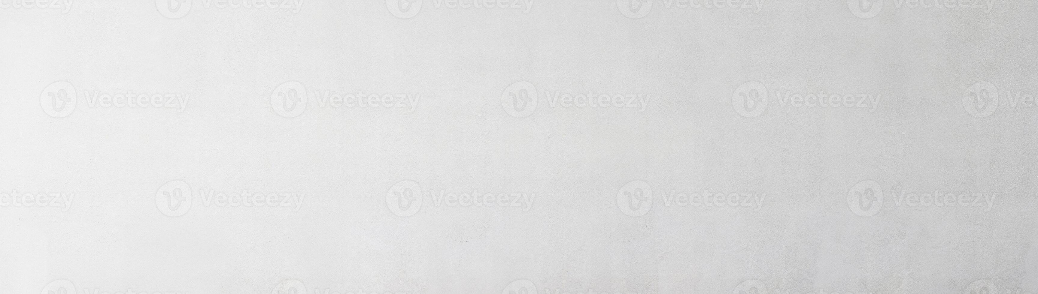 Smooth light gray wall texture with subtle gradient, ideal for background or design elements. photo
