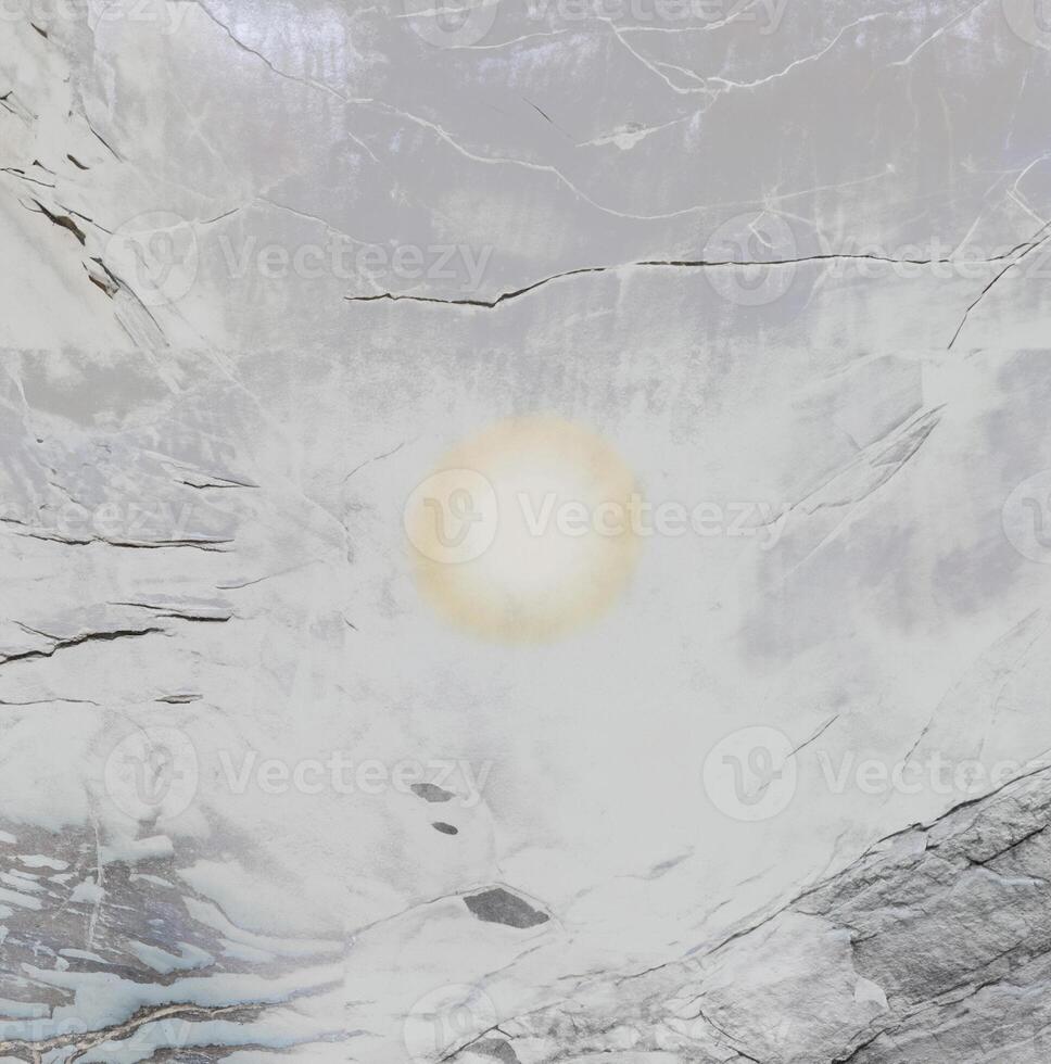 Close-up of a textured stone surface with natural cracks and a soft gradient, ideal for backgrounds and textures. photo