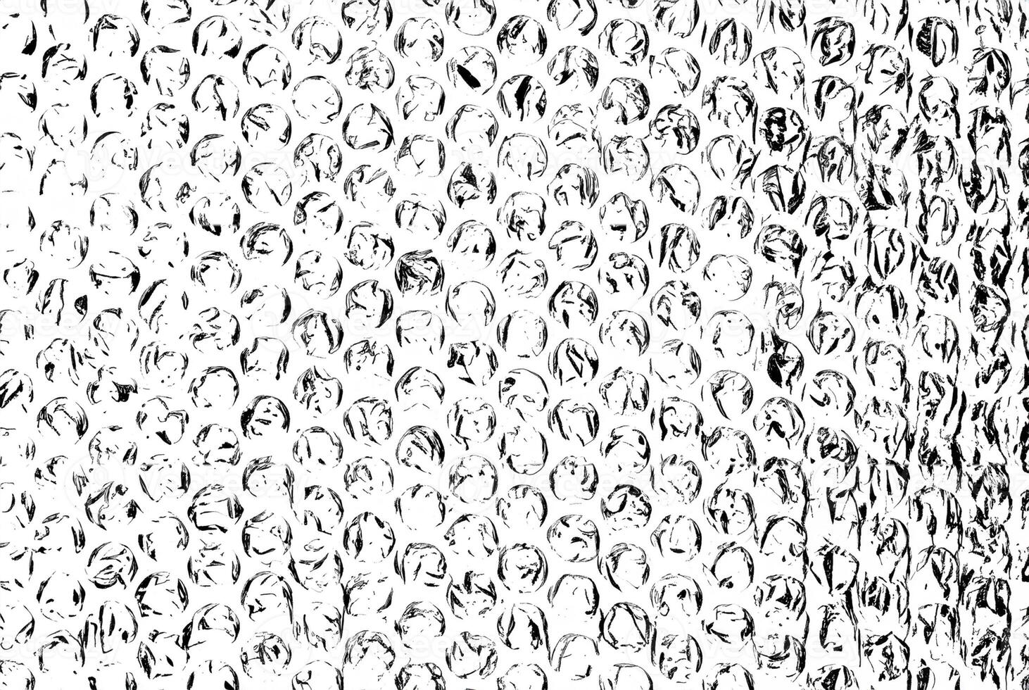 High-contrast black and white bubble wrap texture, featuring circular patterns and crinkled details. photo