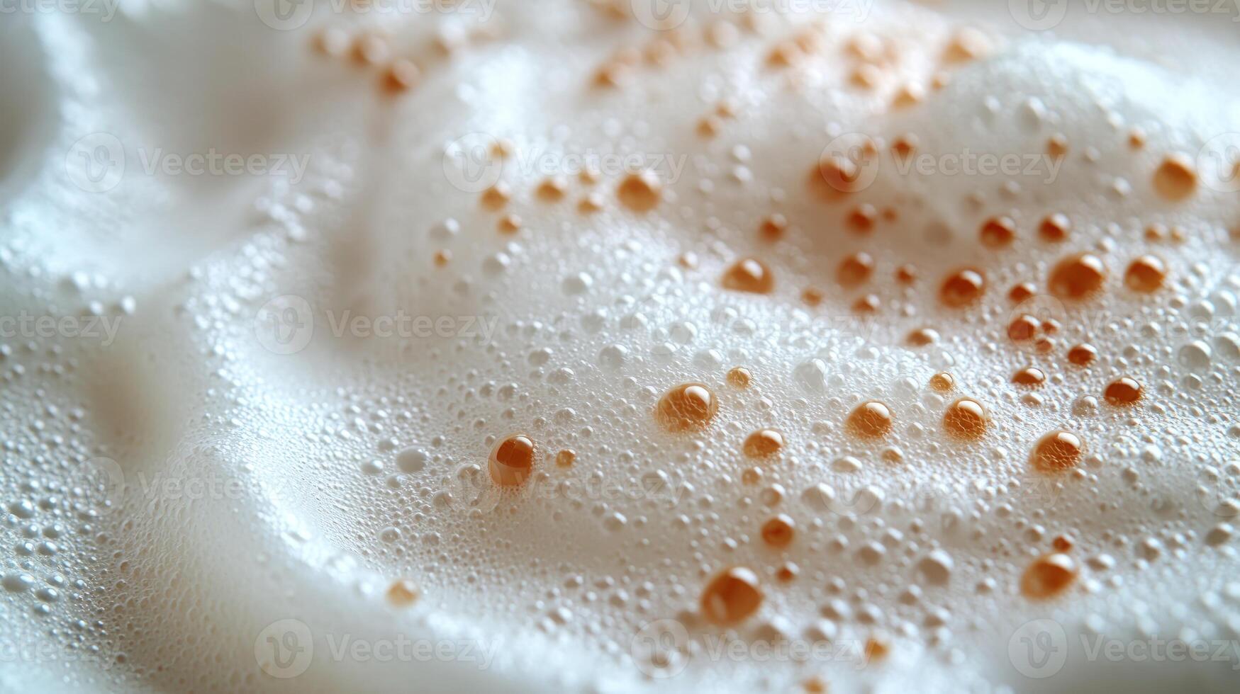 Delicious coffee topped with creamy froth and sprinkled with caramel droplets photo