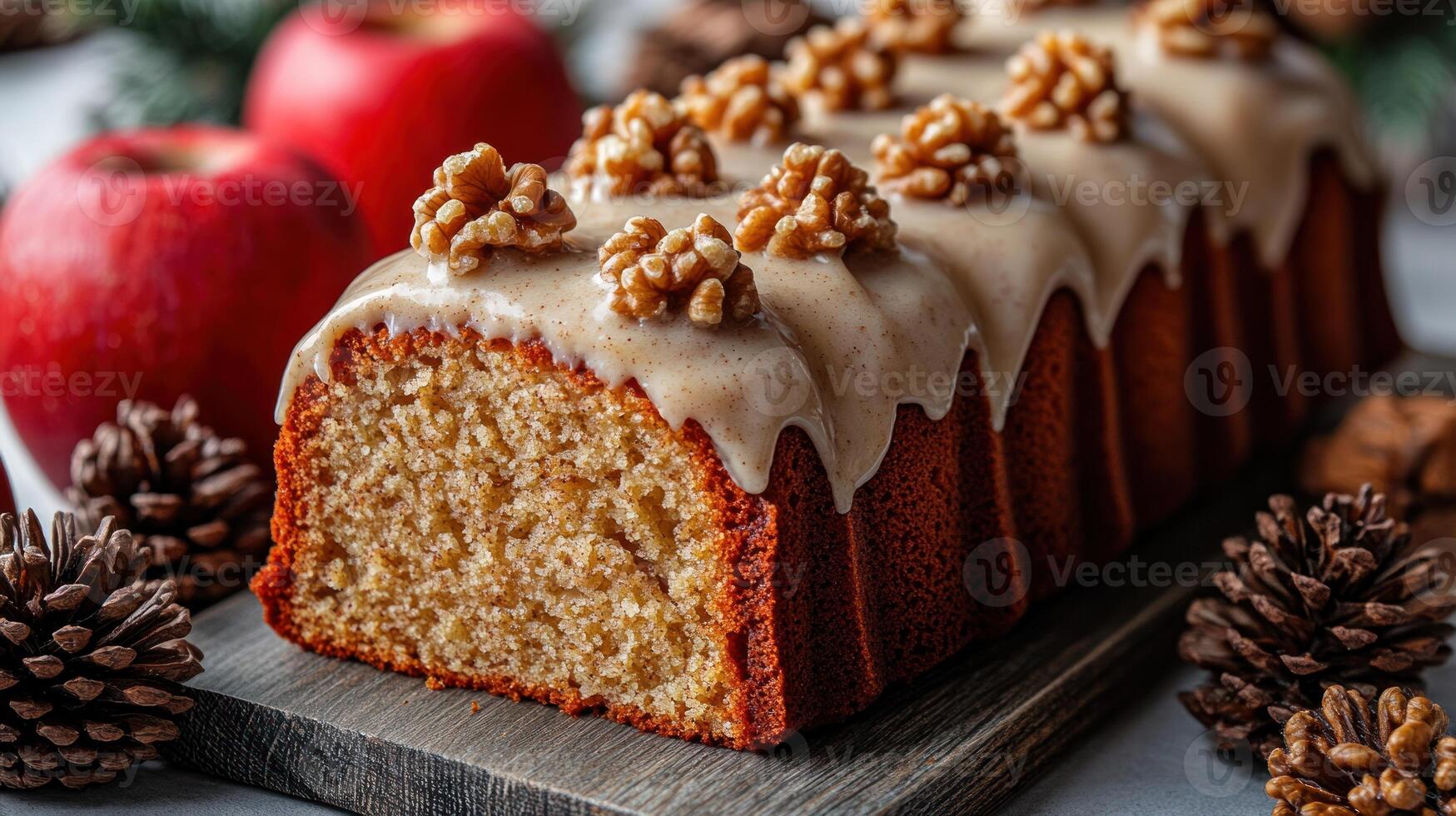 A beautifully decorated apple cake adorned with walnuts and surrounded by pinecones photo