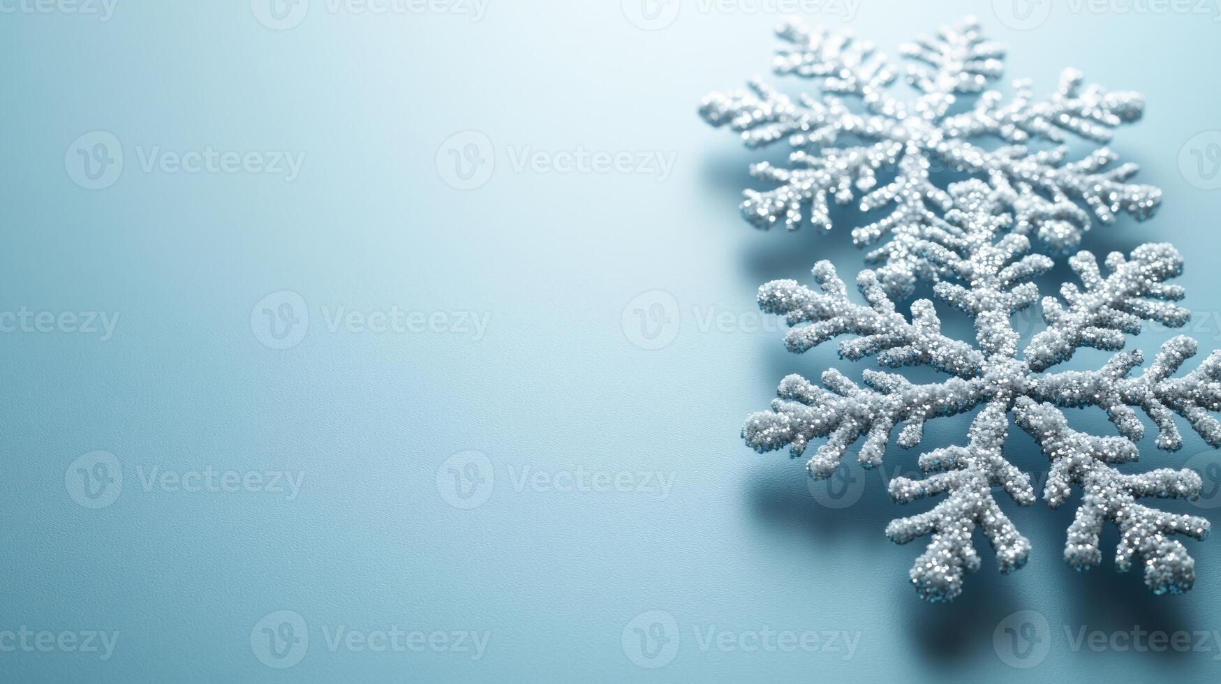 Beautifully crafted snowflakes sparkle gently against a serene blue backdrop photo