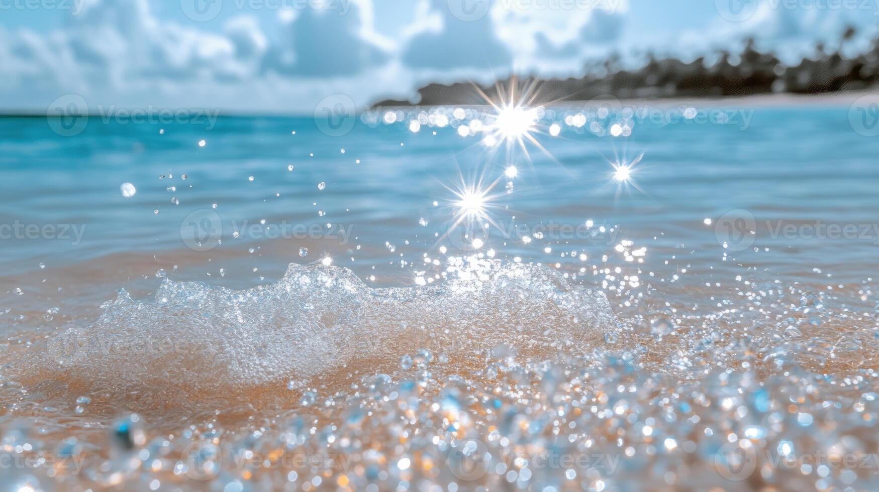 Waves sparkle with sunlight as they kiss the sandy shore, creating a serene atmosphere photo