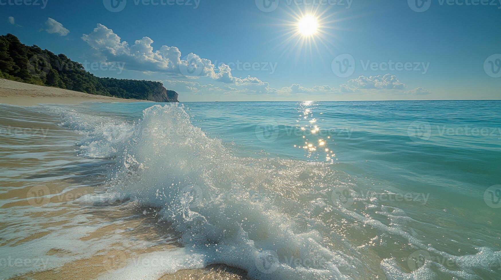 Clear turquoise waters lap the shore while sunlight sparkles on the gentle waves photo