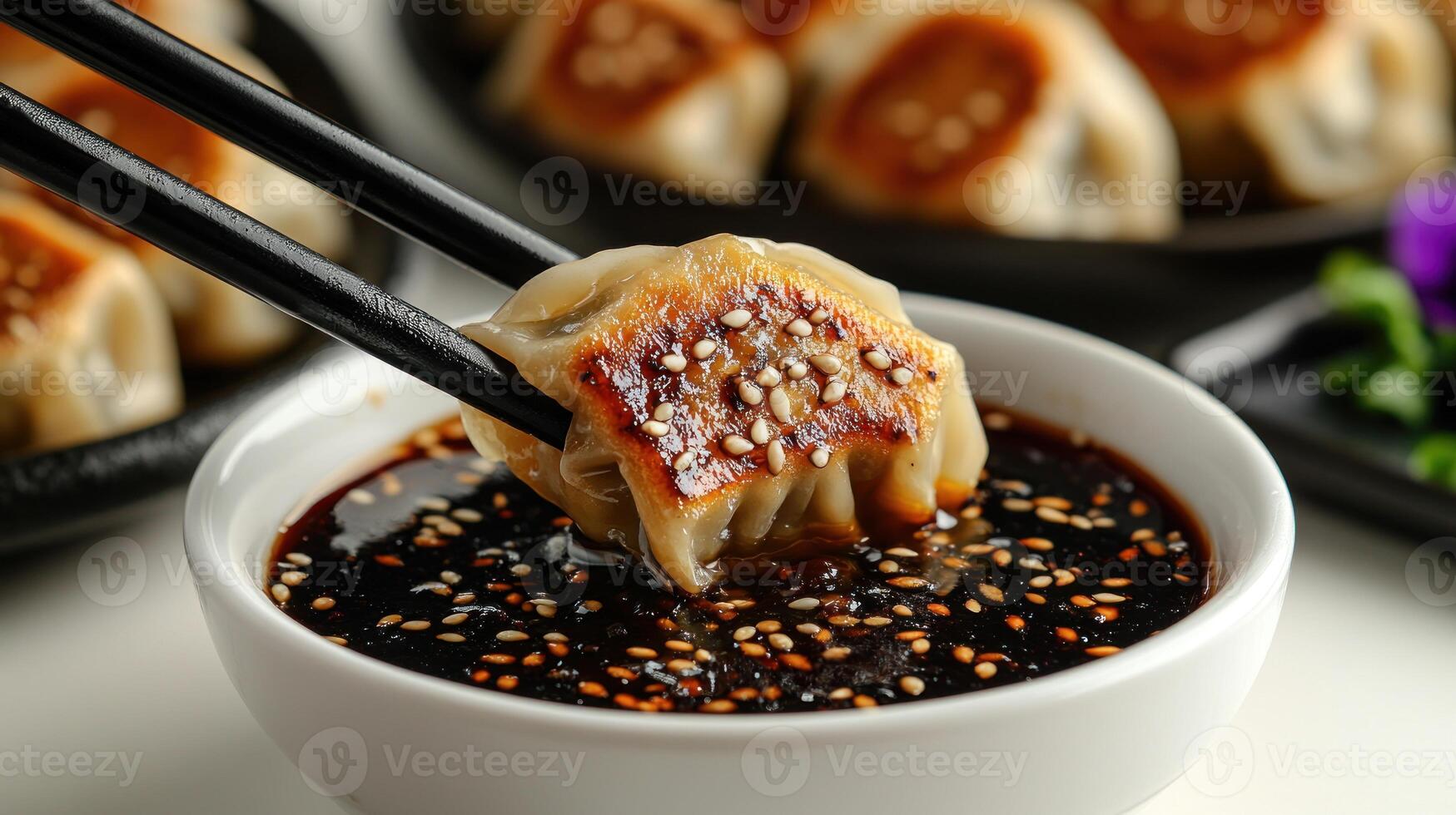 Savoring a perfectly fried dumpling in rich soy sauce as twilight sets in photo