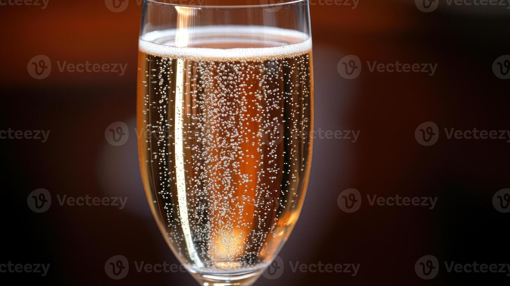A refreshing glass of bubbly champagne sparkles in the soft glow of festive lights photo