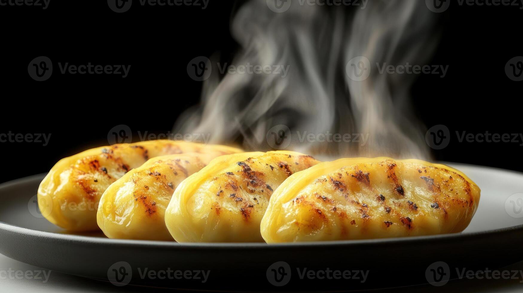Delicious golden dumplings emit steam in a cozy, inviting setting, ready to enjoy photo