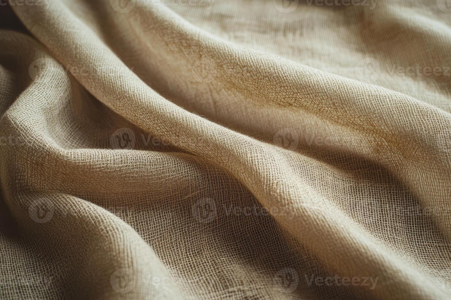 The soft beige fabric creates elegant folds, making it ideal for textile design and home decor projects photo