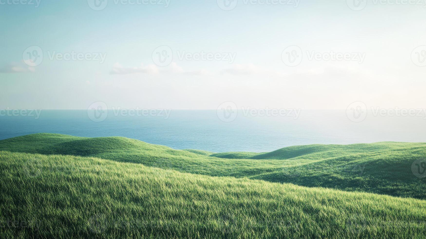 A serene scene of green hills meeting a calm ocean under a clear blue sky, perfect for conveying peace and natural beauty photo