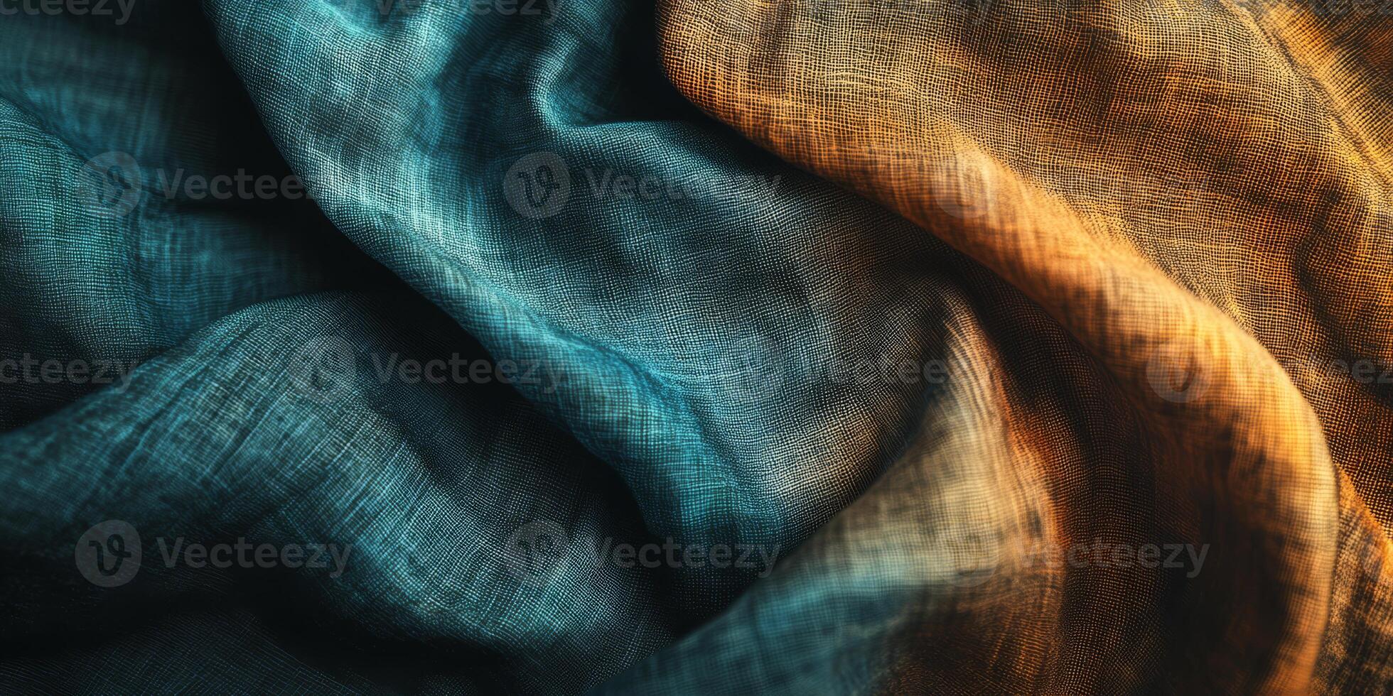 A beautifully draped piece of fabric displaying stunning gradients of both blue and orange hues throughout photo