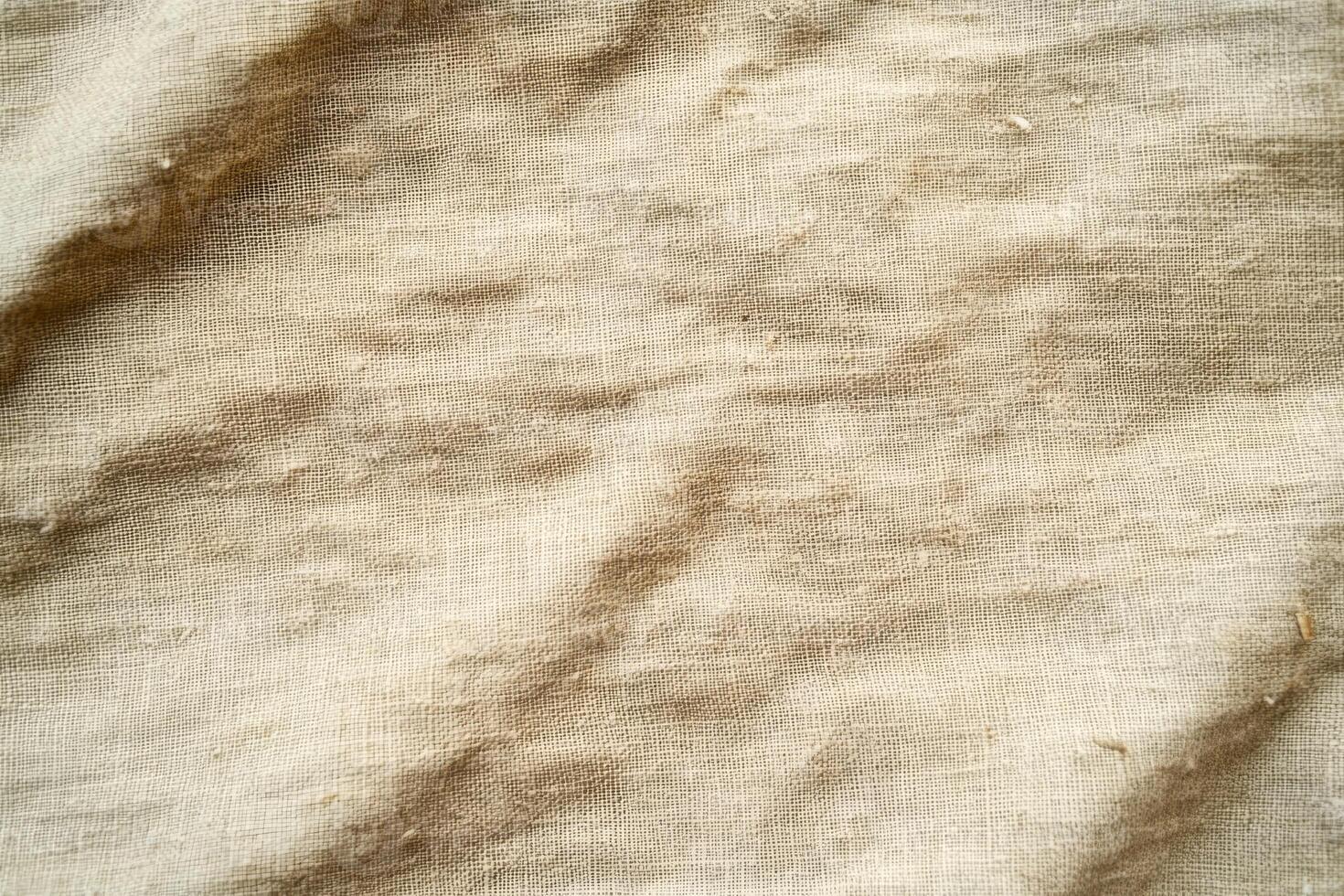 This is a closeup view featuring a soft, elegant beige fabric texture that captivates with its subtle waves and depth photo