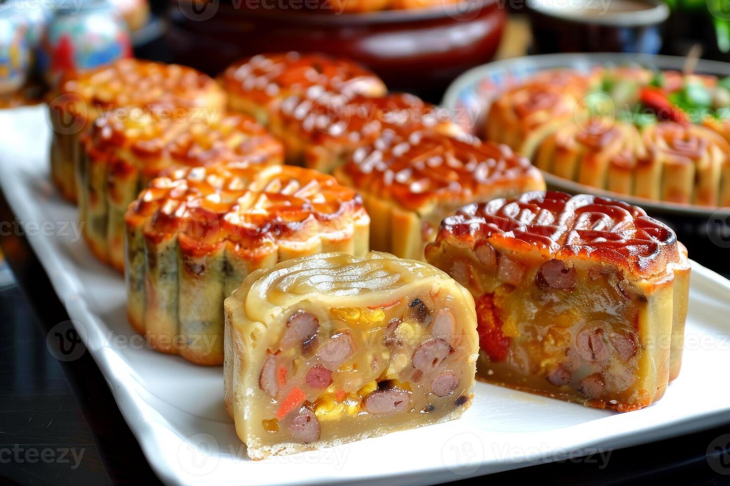 Delight in the exquisite display of authentic Vietnamese mooncakes on a platter, showcasing their flavorful fillings and crisp crusts, embodying the countrys culinary and cultural celebration photo