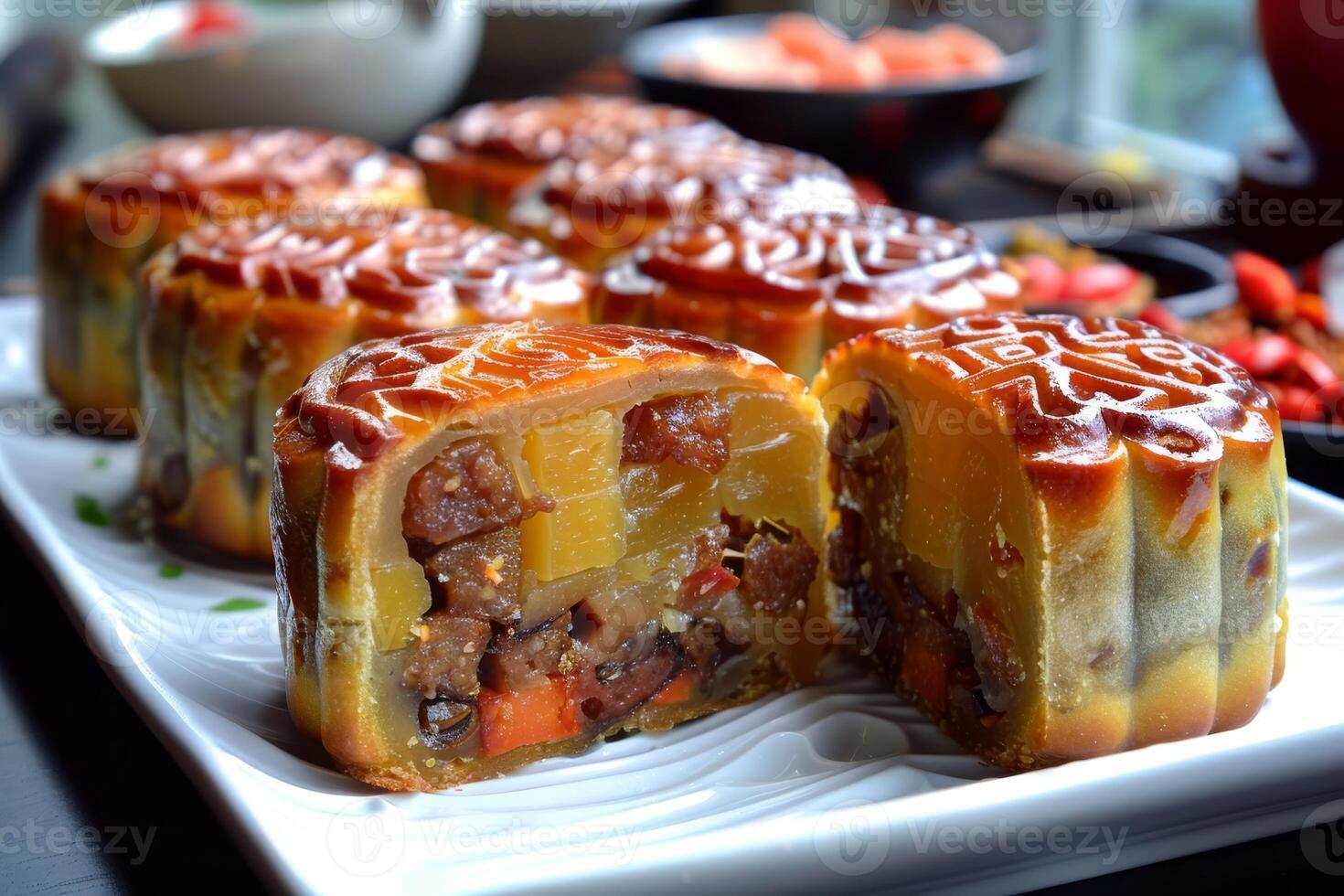 Enjoy the exquisite flavors of Vietnamese mooncakes with a rich mix of nuts, fruits, and salted egg yolk, showcasing intricate traditional craftsmanship and artistry in each piece photo