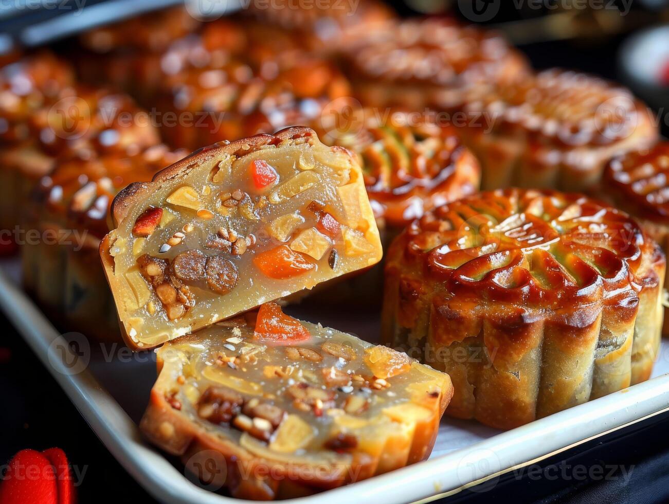 Experience the joy of autumn with delicious Vietnamese mooncakes, handcrafted to perfection with a blend of nuts, fruits, and sweetness. Celebrate the seasons spirit with this artisanal delight photo