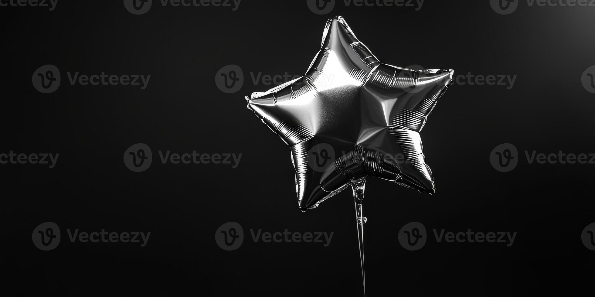 A gleaming silver starshaped balloon majestically floats against a rich black backdrop. It is softly illuminated, creating a stunning and striking contrast that captures the eye effortlessly photo