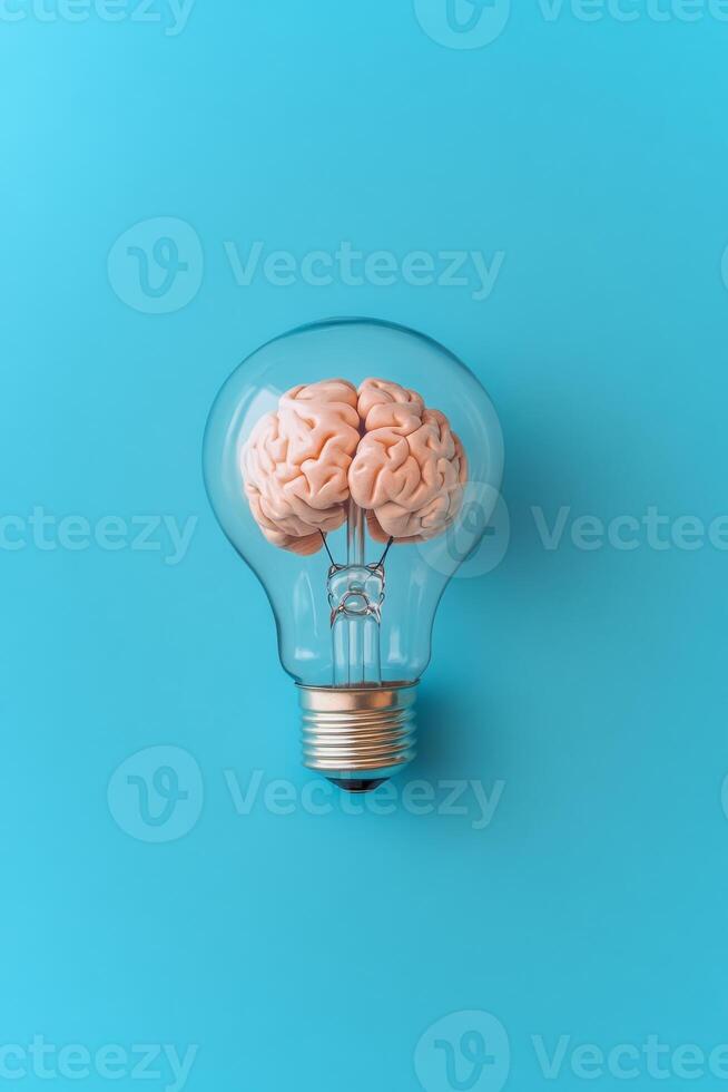 This artwork features a unique human brain inside a light bulb, symbolizing the spark of creativity and innovation, set against a striking vibrant blue background that enhances its impact photo