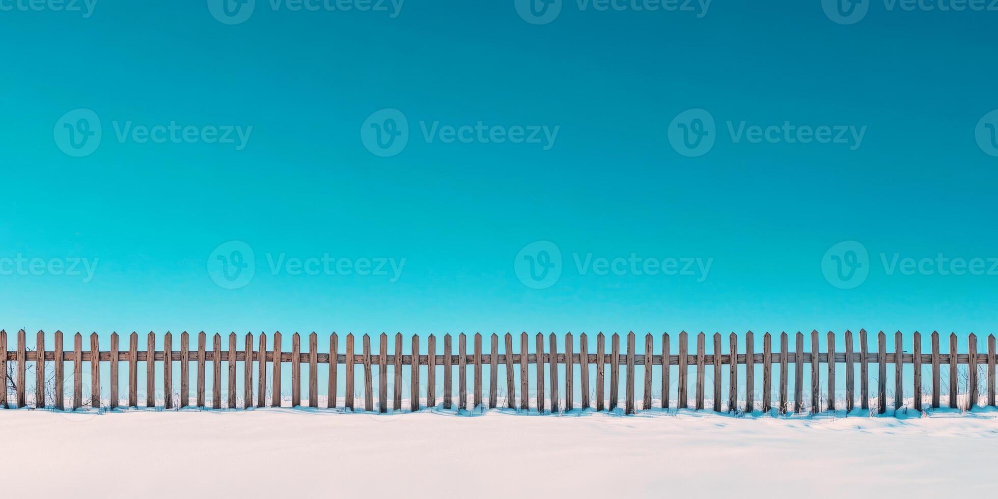 A beautifully serene snowcovered landscape scene features a rustic wooden fence standing against a pristine, expansive white field, which makes it perfect for any kind of text overlay you may desire photo
