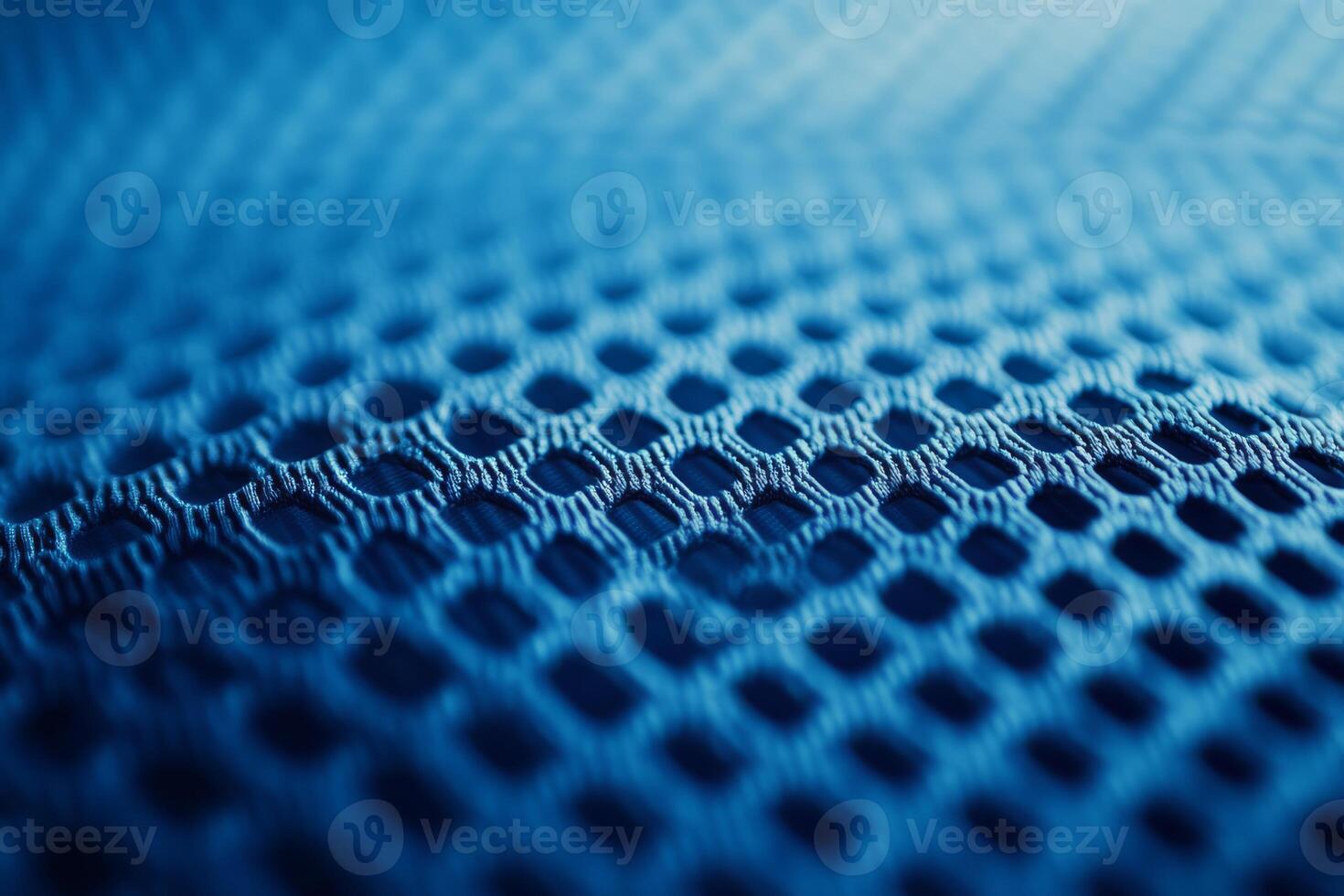 Delve into the fascinating and unique texture of the blue fabric specifically designed for sports jerseys, which includes a breathable mesh pattern essential for highquality athletic wear photo