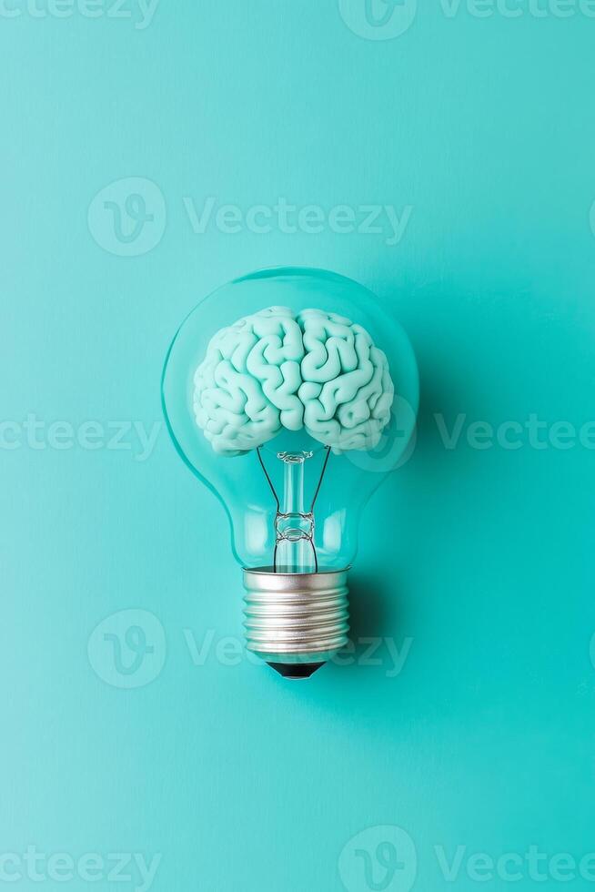 This imaginative artwork features a human brain ingeniously placed inside a glowing light bulb, serving as a powerful symbol of innovation and the generation of groundbreaking ideas photo