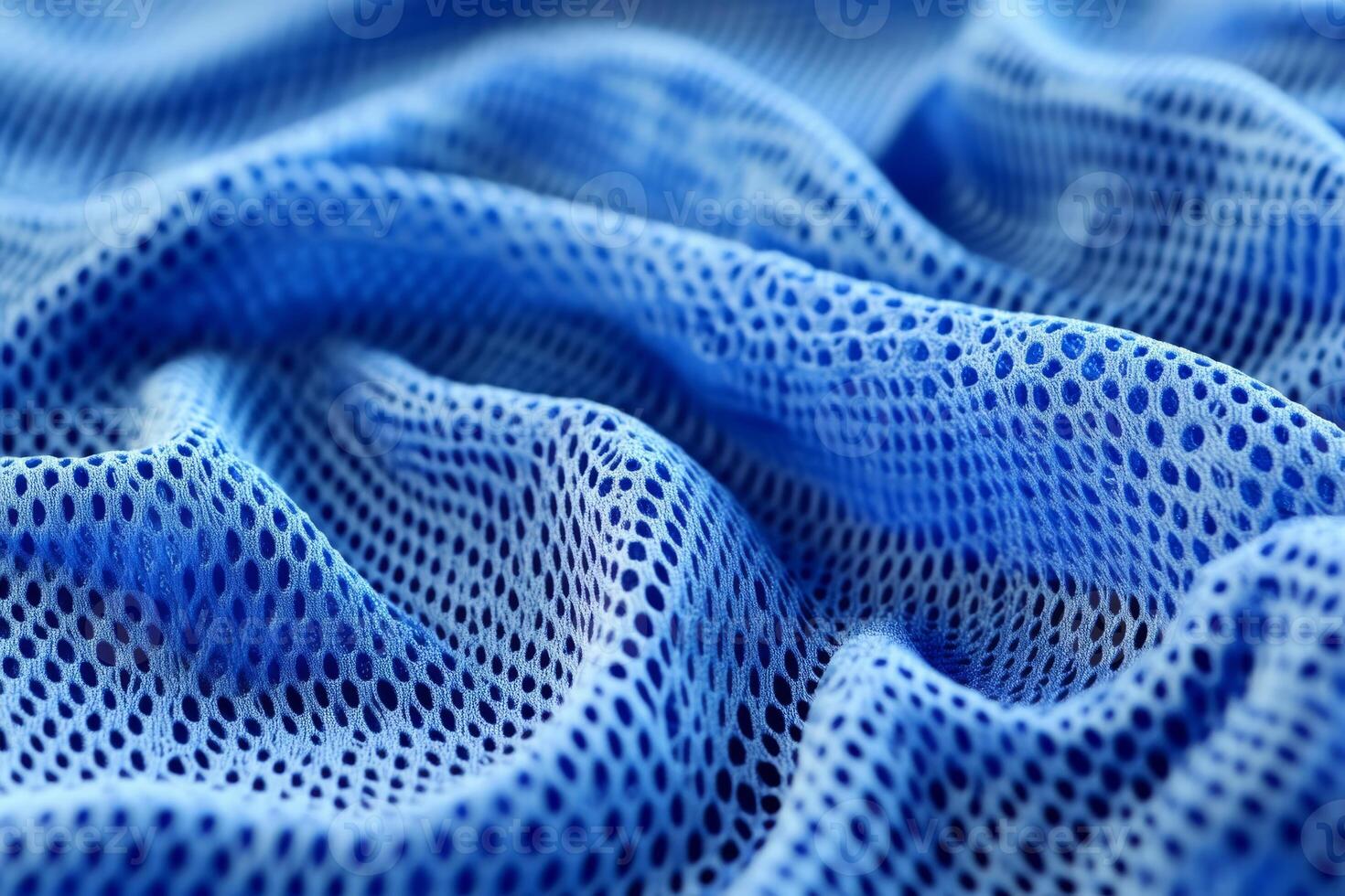 A closeup of vibrant blue fabric perfect for highquality sports jerseys. Its breathable mesh design ensures comfort during athletic activities, making it an ideal choice for sportswear photo