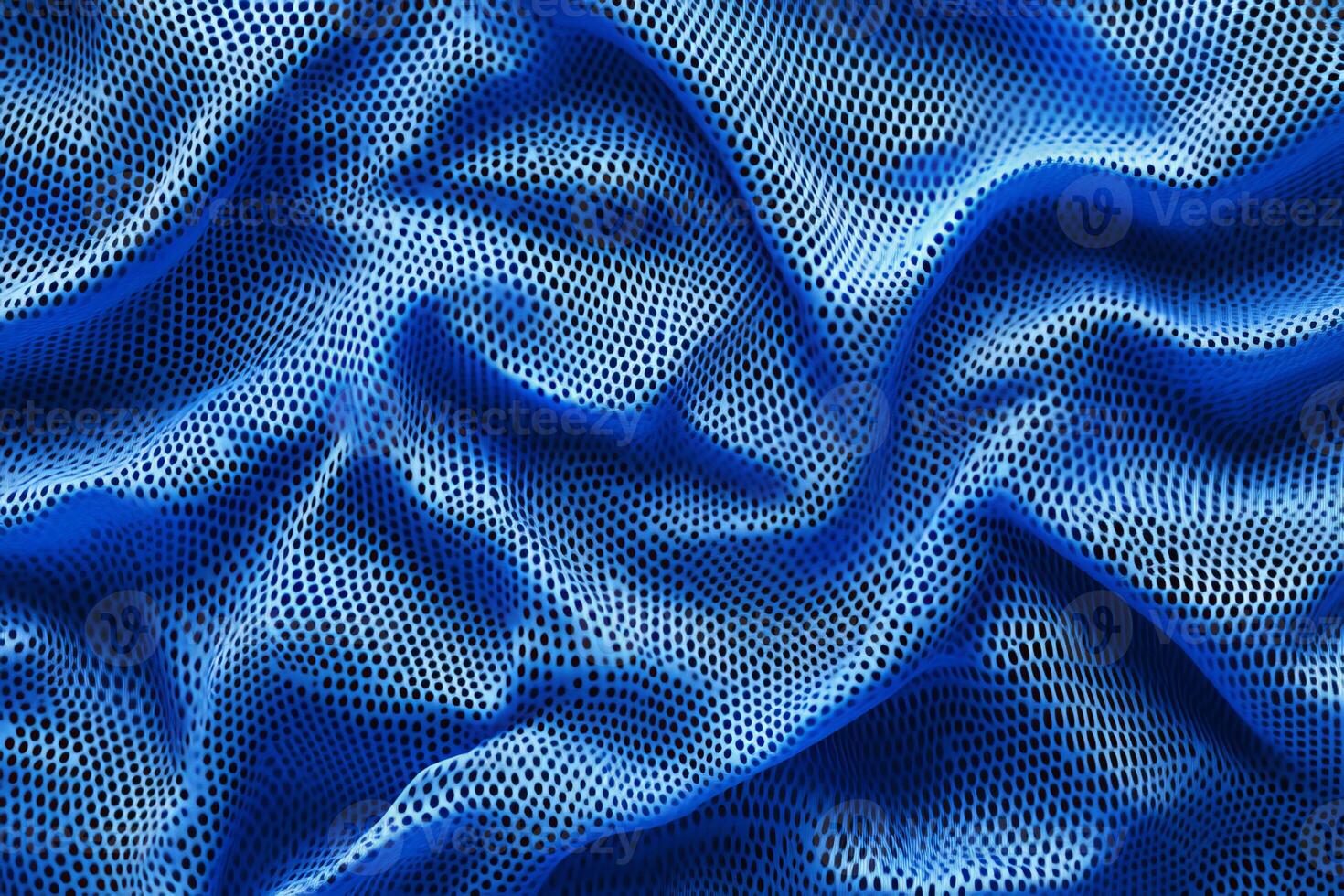 This striking and vivid blue fabric texture is perfect for sports jerseys. It showcases smooth and dynamic waves, making it an excellent choice for all types of activewear designs photo