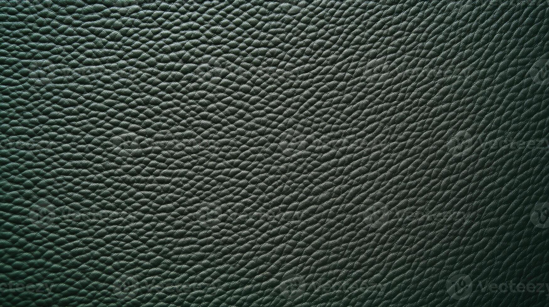 This is a rich and beautifully textured green leather surface that is perfect for various design and media applications photo